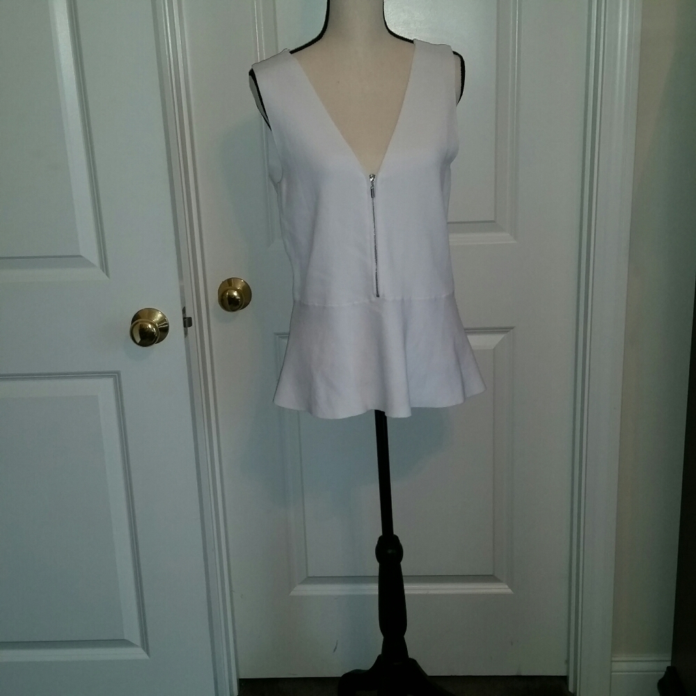 Zip front sleeveless peplum knit top